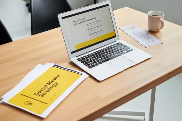 Close-up of a laptop showing a social media marketing strategy in an office setting. Media buying agencies market entry: England launch checklist